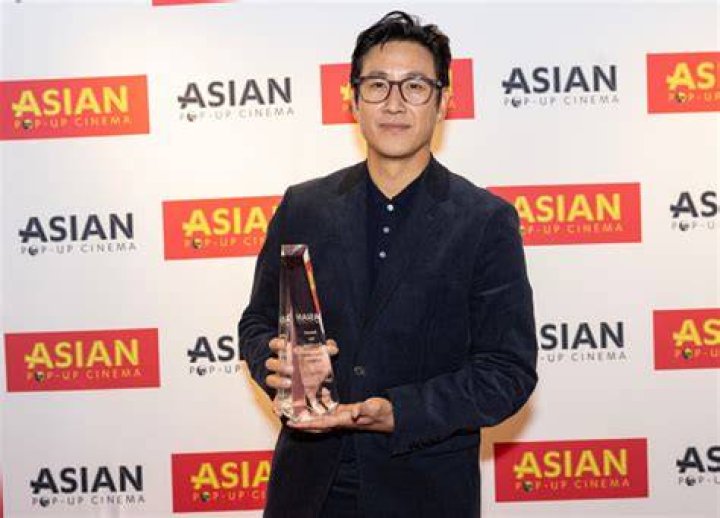 Actor Lee Sun Kyun receives the award for "Excellent Achievement in Film" during the introduction of the "Killing Romance" Midwest premiere at AMC ...