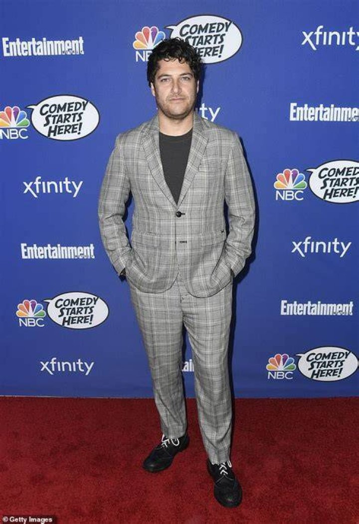 Adam Pally Posing for his Instagram feed by wearing a cap.