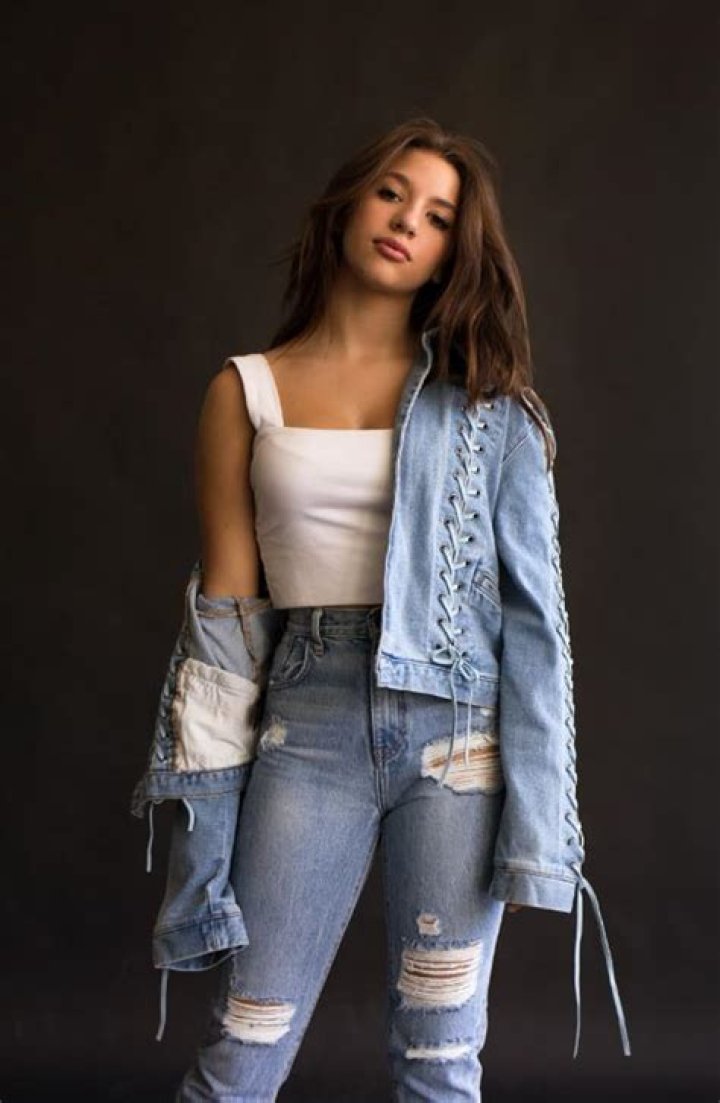Mackenzie Ziegler posing for a leggins from Justice