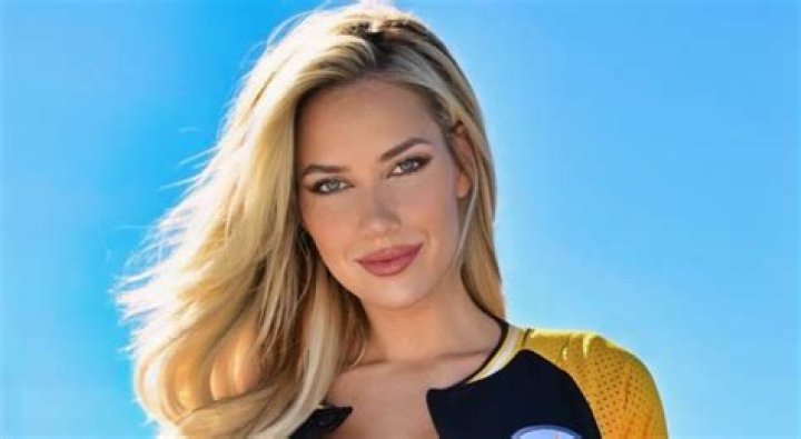 Paige Spiranac posing with the car